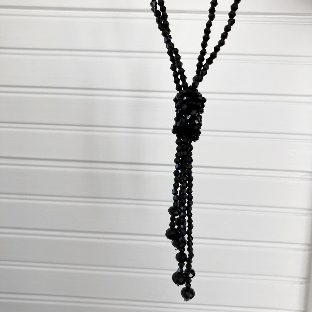 2 strands of black crystal beads. Worn as lariat or wrap necklace.
